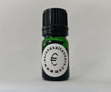 Load image into Gallery viewer, Small green bottle with a black cap on a light gray background